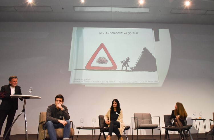 Das Symposiumsthema als Karikatur von Cartoonist Carlo Schneider ausgedrückt. (Foto Flavia Rivola)
